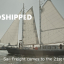 Apollonia ship with industrial freight cranes and text Windshipped: Sail Freight comes to the 21st Century"